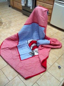 My daughter walking around with her Cat In The Hat quilt.