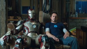 Tony Stark and his latest armor, both somewhat worse for wear.