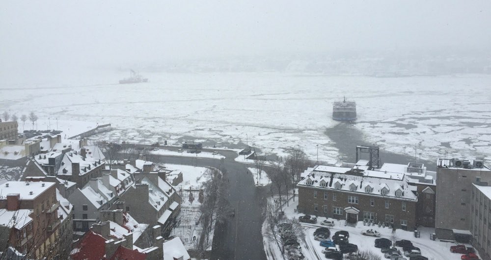 boats break through the ice of the St. Lawrence river