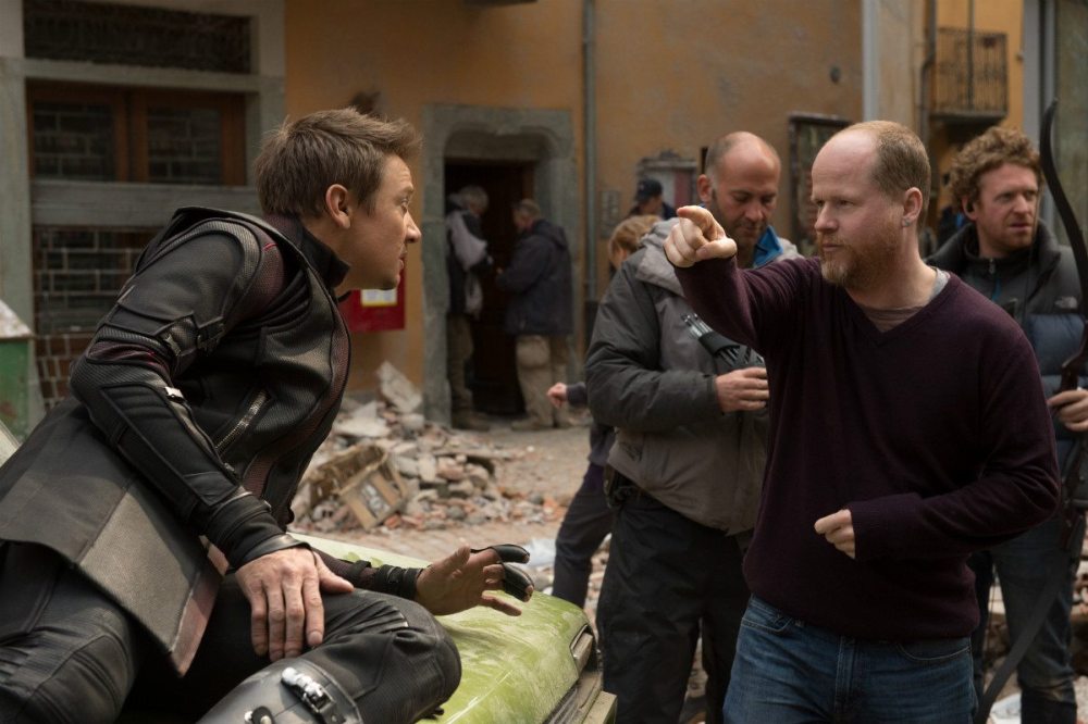 Whedon giving direction to Jeremy Brenner ("Hawkeye") on set - Photo: Disney/Marvel