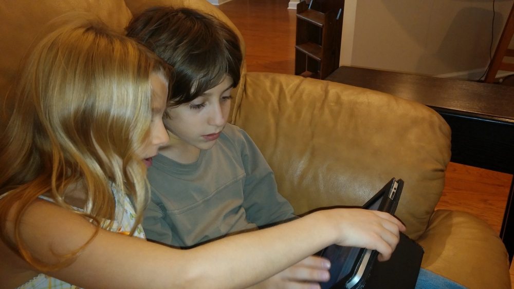 My daughter advising her big brother on his coding choices.