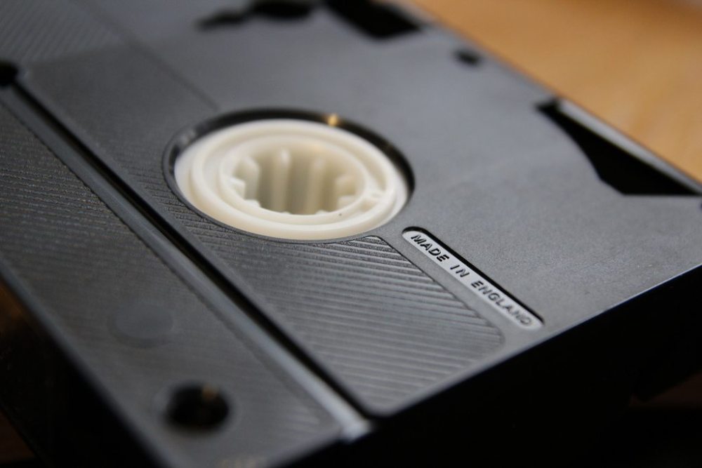 A mainstay throughout the 1980s, video cassettes brought relatively advanced recording technology into the home. (Public domain image from Flickr user comedy_nose).