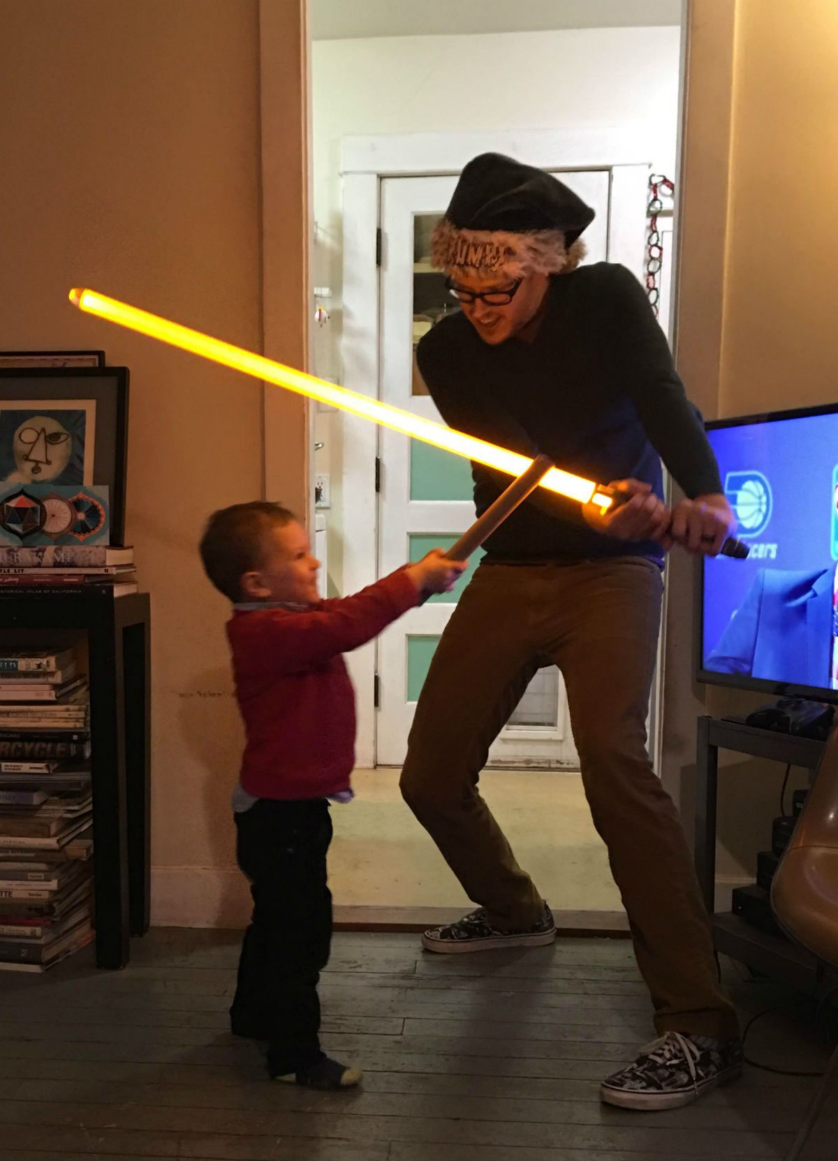 Proper light saber technique: don't hit the TV! Photo by Sarah James