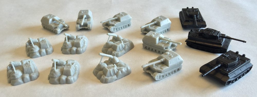 Close up of 3 different Memoir '44 Equipment Pack units, the tanks having been spray painted black.