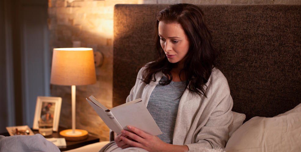 Philips Hue White Ambiance in a warm reading scene