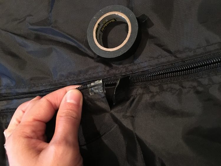 I placed tape at the point of the cuts on the zipper to prevent the ends coming loose. Photo via author.