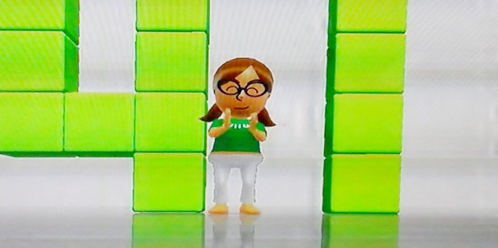 Screenshot of the author's Mii cheering on her Wii Fit progress