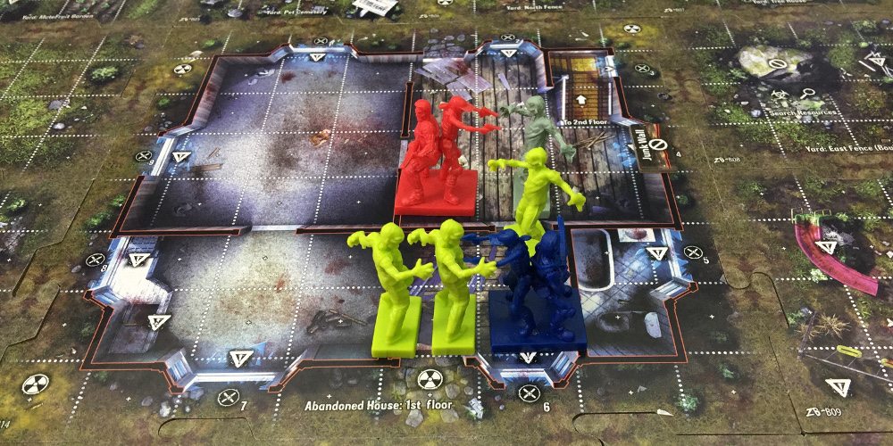 A close-up of player squads and zombies on the Zpocalypse 2 board.