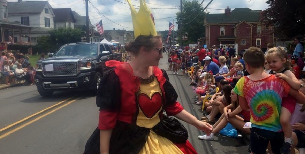 the author as the queen of hearts in a parade