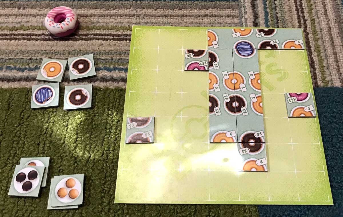 Dollars to Donuts player mat and tokens