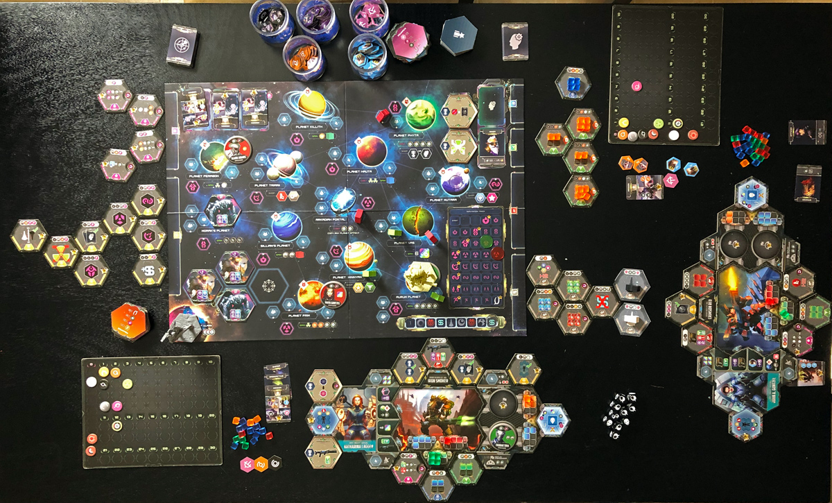 Overhead photo of the tabletop with all of the game components at the end of a two player session with the expansion.