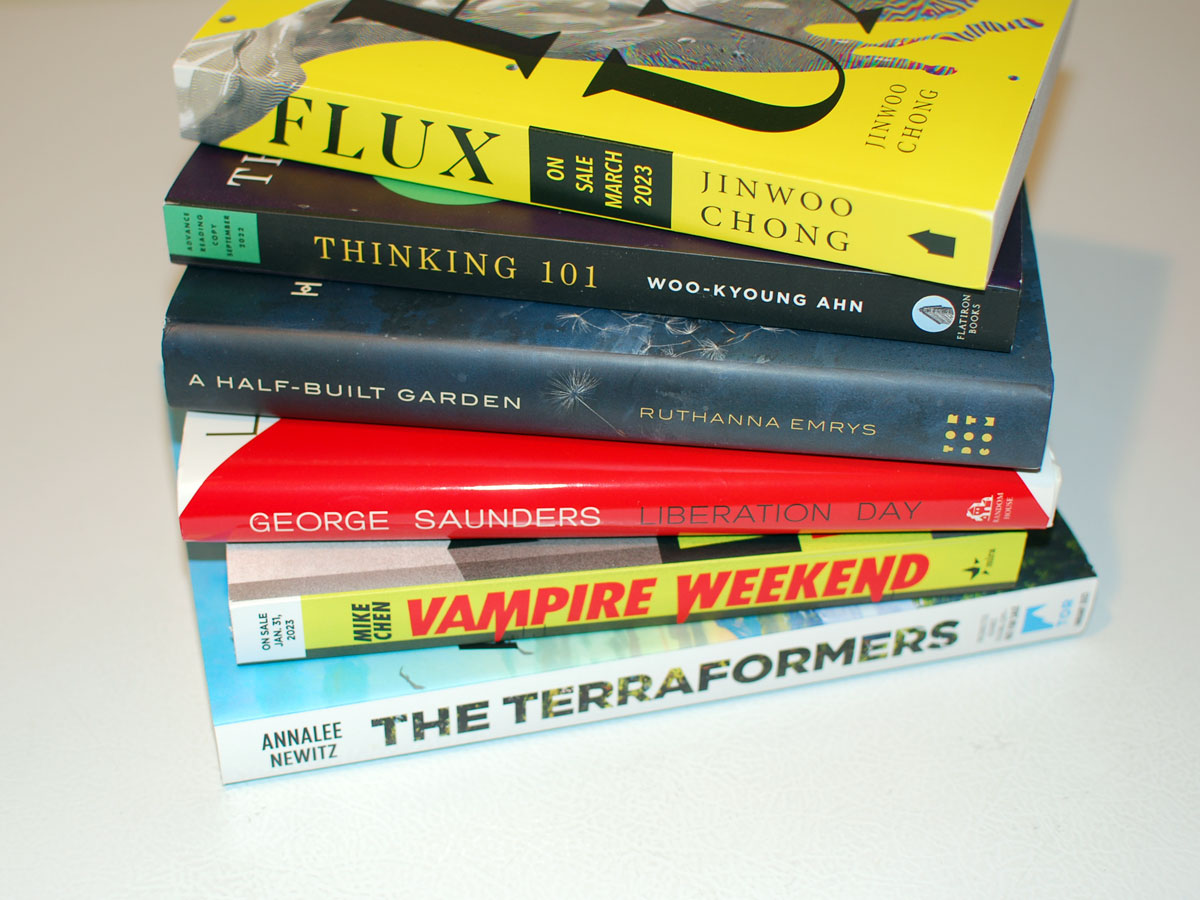 Stack of books: Flux, Thinking 101, A Half-Built Garden, Liberation Day: Stories, Vampire Weekend, The Terraformers