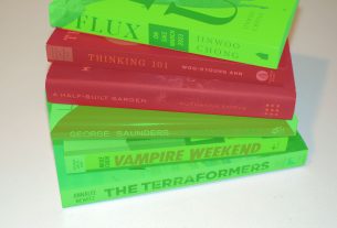 Stack of books, some colored green and some colored red